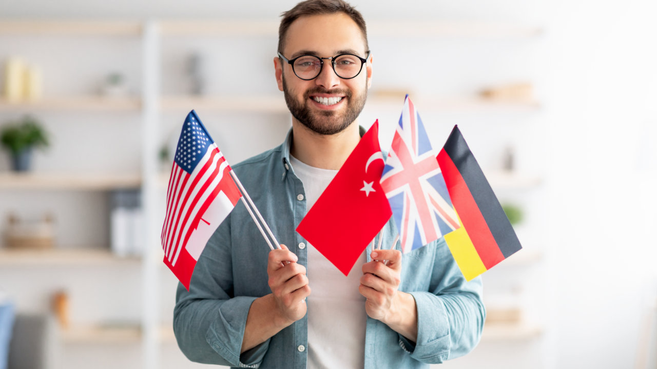 man with flags of several countries