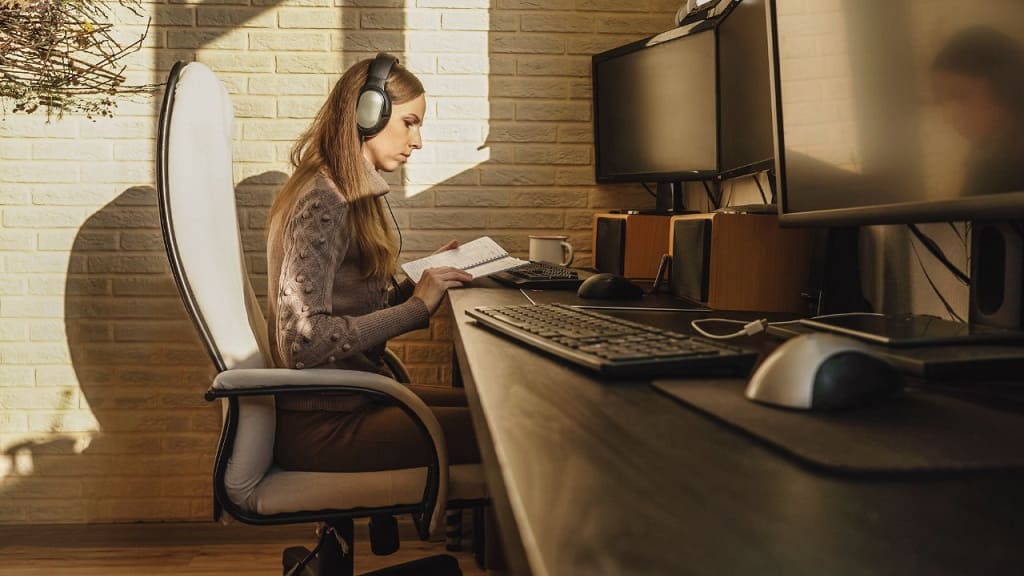 woman reading from her work office