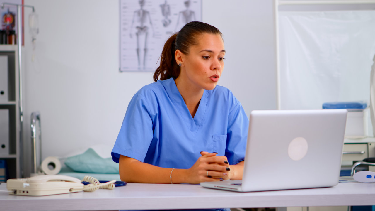 doctor attending patient using computer