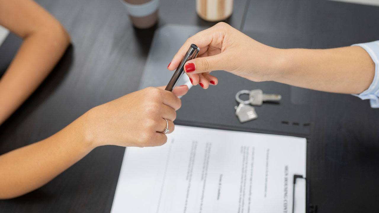 Woman signing lease